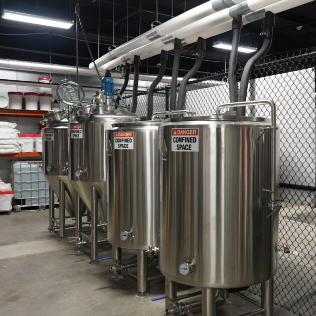 Stainless process vessels in a grain-to-spirit production area.