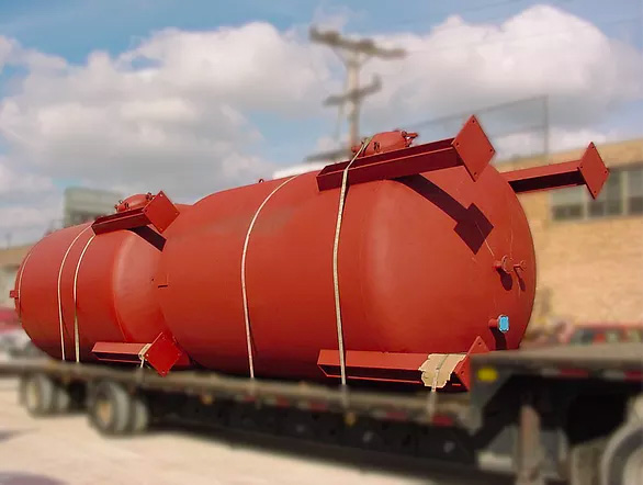 Large fiberglass vessels built for aggressive chemical containment.
