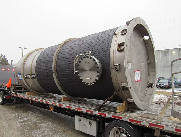 Code-stamped FRP pressure vessels staged after qualification testing.